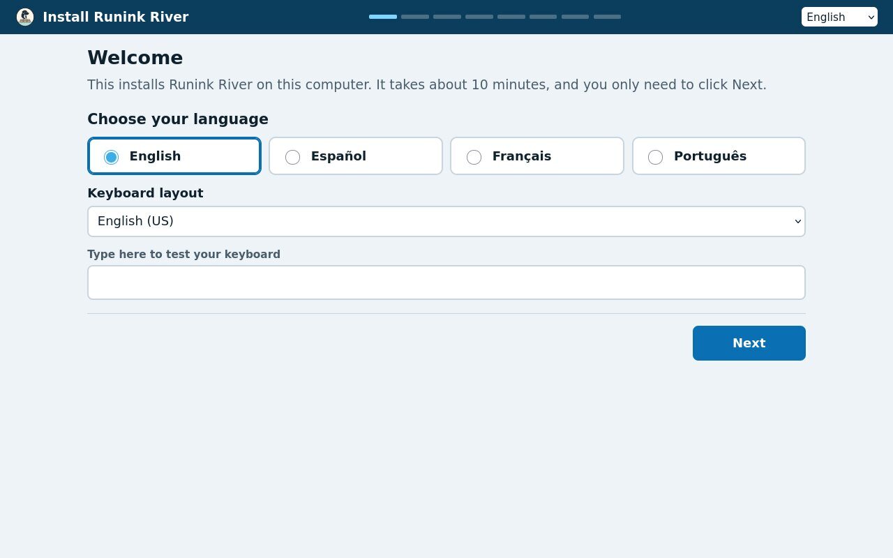 The graphical installer's welcome screen: choose English, Spanish, French or Portuguese and a keyboard layout, then Next.